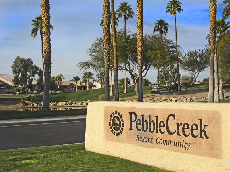 PebbleCreek, Goodyear Arizona — Robson Resort Community entrance with palm trees